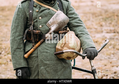 Close up of German military ammunition of a German soldier At World War II. Warm autumn clothes, soldier's overcoat, gloves, helmet, pouch, sapper sho Stock Photo