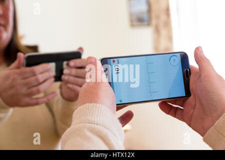Kardia heart monitor app being used on a Samsung android phone Stock Photo