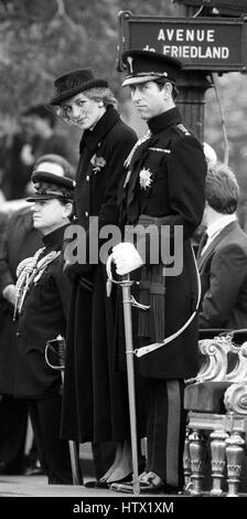 The Prince of Wales, wearing the uniform of Colonel of the Welsh Guards, with the Princess of Wales, as they watch the Armistice Day parade from the review stand at the Arc de Triomphe in Paris. Stock Photo