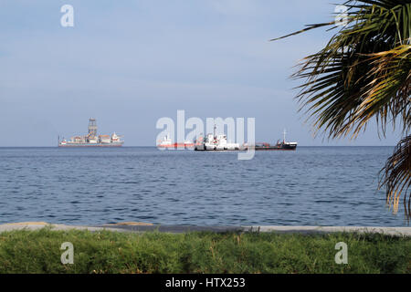 The Island Challenger (right), an oil products tanker, lying off the coast from Limassol, Cyprus, with other vessels. Stock Photo