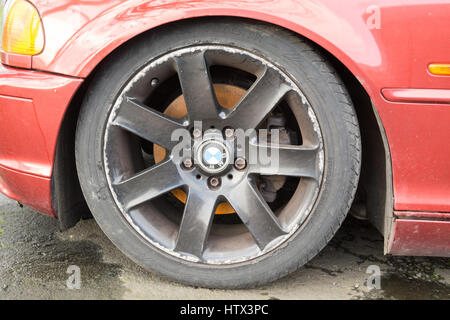 kerbing curbing damage to alloy wheels Stock Photo