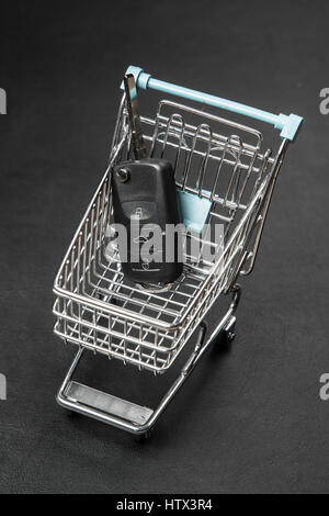 Car keys in a shopping cart Stock Photo