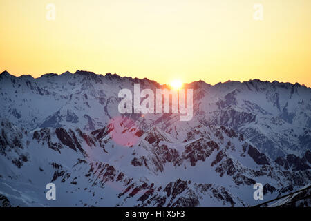 Amazing winter sunset views of the mountain landscape, from Pic Du Midi in the French Pyrenees.  spectacular coloured sky Stock Photo