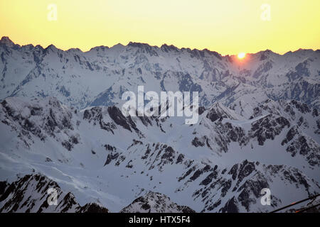 Amazing winter sunset views of the mountain landscape, from Pic Du Midi in the French Pyrenees.  spectacular coloured sky Stock Photo