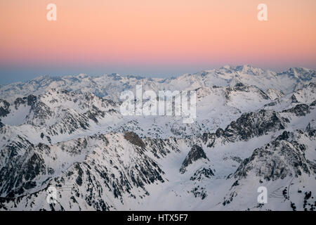 Amazing winter sunset views of the mountain landscape, from Pic Du Midi in the French Pyrenees.  spectacular coloured sky Stock Photo