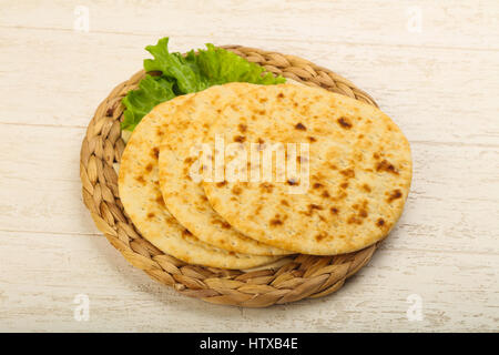 Pita bread with salad over wood background Stock Photo