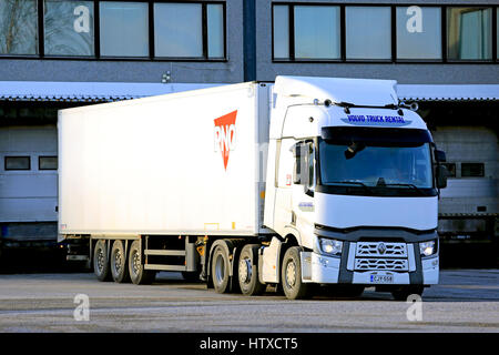 SALO, FINLAND - MARCH 12, 2017: White Renault Trucks T semi trailer on a loading dock of a warehouse in the evening. Stock Photo