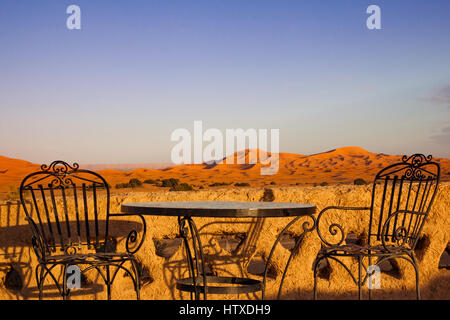 Table and chair on hotel roof top terrace in Sahara desert,  Morocco Stock Photo