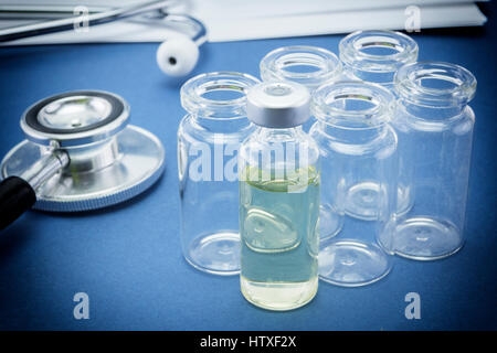 Test medication and stethoscope, administration of serum system Stock Photo