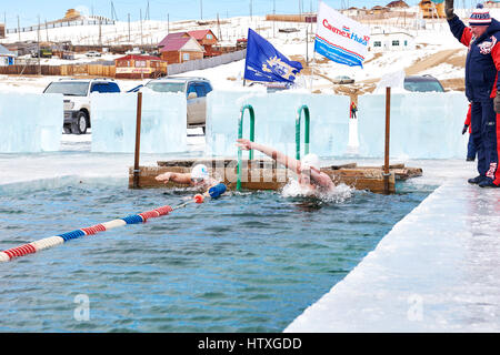 SAHYURTA ,IRKUTSK REGION, RUSSIA - March 11.2017: Cup of Baikal. Winter Swimming. Butterfly 25 meters. Men Stock Photo