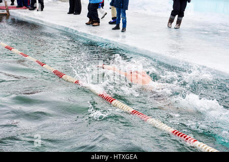 SAHYURTA ,IRKUTSK REGION, RUSSIA - March 11.2017: Cup of Baikal. Winter Swimming. Butterfly 25 meters. Men Stock Photo