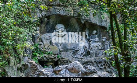 China, Hangzhou. Monastery Soul SanctuaryTemple (Lininsy). Sculpture laughing Buddha - Hotei. It is believed that touching the stomach sculpture bring Stock Photo