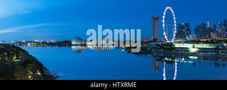 View of Singapore Flyer, Gardens by the Bay and Marina Bay Sands Hotel at dawn, Singapore Stock Photo