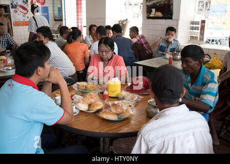 Patrons at a teahouse in Maha Bandoola Road, Yangon, Myanmar Stock Photo