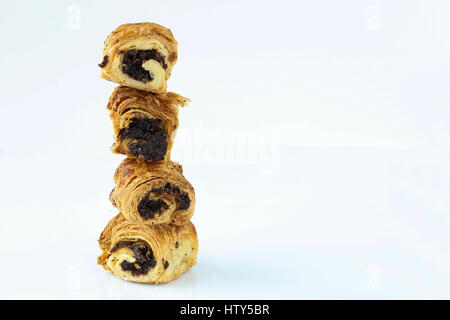 A tower of sweet rolls with poppies, which stand vertically on each other Stock Photo
