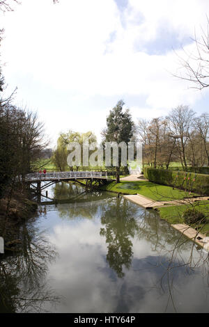 Arched footbridge over a river in Oxfordshire Stock Photo