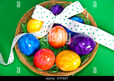 colorful Easter eggs in a basket Stock Photo