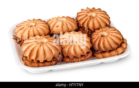 Shortbread biscuits with filling in plastic tray isolated on white background Stock Photo