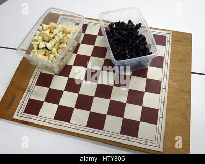 Chess board with pieces in boxes Stock Photo