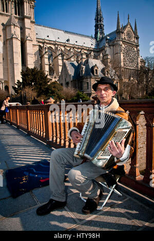 Musician near Notre Dame Cathedral. Paris, France, Europe. Stock Photo