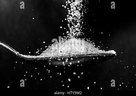 Sugar on spoon Stock Photo