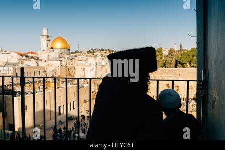 Silhouette of ultra orthodox man and Jewish boy near the Temple Mount, Jerusalem Stock Photo