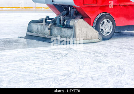 Ice resurfacer driving across on an ice rink Stock Photo