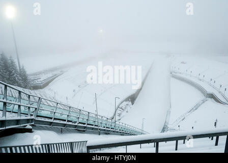 Holmenkollen ski jump in foggy winter day, Oslo, Norway Stock Photo