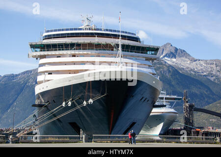 Cruise liners docked in Skagway town, popular touristic place in Alaska. Stock Photo