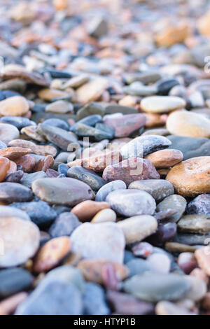 Image of natural stones at a beach in Morocco photographed with natural light and a very shallow depth of field. Stock Photo