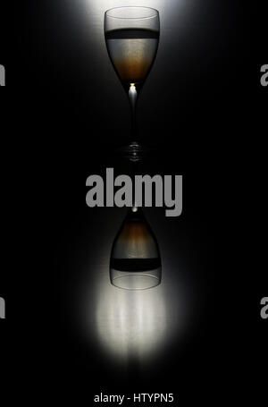 Drop of ink in glass of water silhouette Stock Photo