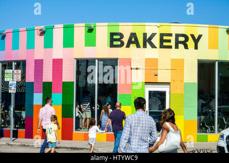 Florida South,Miami,Wynwood,urban graffiti,street art artwork,painted wall mural,Zak the Baker BAKERY,building,exterior,entrance,colorful,store,family Stock Photo