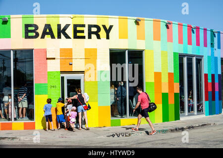 Florida South,Miami,Wynwood,urban graffiti,street art artwork,painted wall mural,Zak the Baker BAKERY,building,exterior,entrance,colorful,store,family Stock Photo