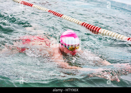 SAHYURTA, IRKUTSK REGION, RUSSIA - March 11.2017: Cup of Baikal. Winter Swimming Competitions. Breaststroke. Woman Stock Photo
