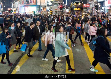 A busy bustling intersection in Causeway Bay, Hong Kong, for pedestrians crossing the street with some motion blur. Stock Photo