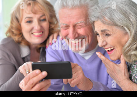 Elderly people  using mobile phone Stock Photo