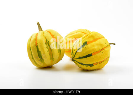 three small striped pumpkins on white background Stock Photo