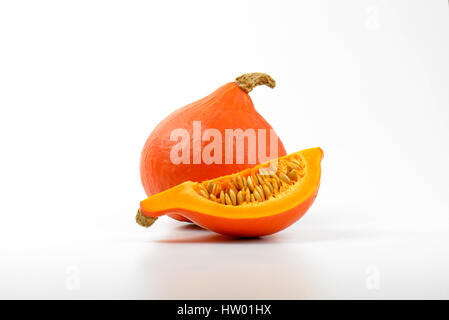 one and quarter of pumpkins on white background Stock Photo