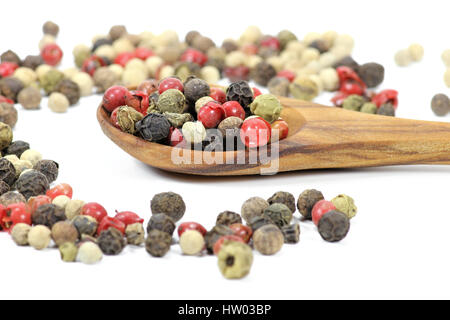 wooden spoon with mixed peppercorns isolated on white background Stock Photo