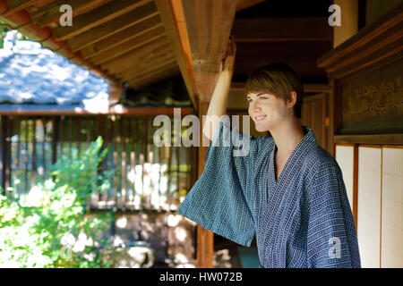 Caucasian man wearing yukata in traditional Japanese house Stock Photo