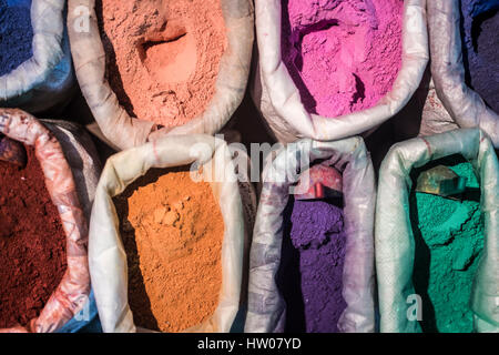 Morocco, Chechaouen. Containers of colorful pigments, powders or dyes on historical village street. Stock Photo