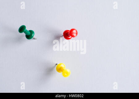Set of push pins in different colors, with real shadows, isolated on white background. (Selective Focus) Stock Photo