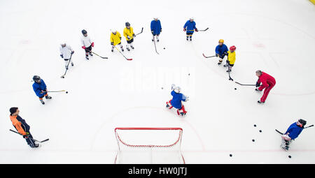 (170316) -- WUHAN, March 16, 2017(Xinhua) -- Photo taken on Feb. 25, 2017 shows ice hockey players of Binglong International Skating Club taking a training at a shopping mall in Wuhan, central China's Hubei Province.     Keeping up a sound and steady pace of development, the Chinese sports industry was booming in 2016. The National Fitness Program (2016-2020) and the 13th Five-year Plan on the Sports Industry were both issued in 2016 to offer a clear direction for China's national strategy of ensuring public fitness and the development of the sports industry. Stock Photo