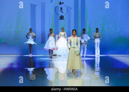 Beijing, China. 16th Mar, 2017. Models present fashion designs during a graduation design show at the Beijing Institute of Fashion Technology (BIFT) in Beijing, capital of China, March 16, 2017. Credit: Li Jianbo/Xinhua/Alamy Live News Stock Photo
