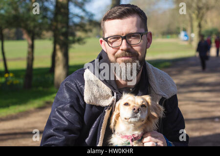 Dogs playing in Bute park, Cardiff with their owners. Stock Photo