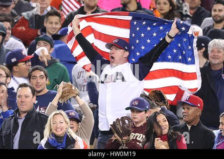 Los Angeles, California, USA. 22nd Mar, 2017. A USA fan celebrates a scoring play in the game between the the United States and Puerto Rico, World Baseball Classic Finals, Dodger Stadium in Los Angeles, CA. Peter Joneleit /CSM/Alamy Live News Stock Photo