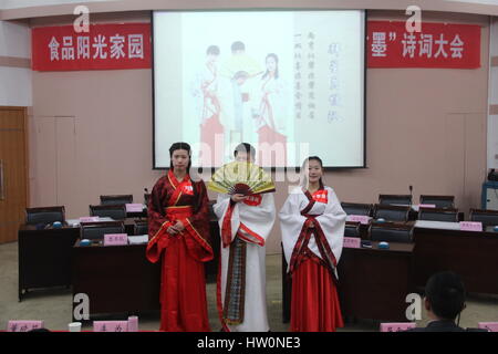 March 22, 2017 - Zhengzh, Zhengzh, China - Zhengzhou, CHINA-March 22 2017: (EDITORIAL USE ONLY. CHINA OUT)..College students wearing traditional Chinese clothes take part in the competition of Chinese poems in Zhengzhou, central China's Henan Province, March 22nd, 2017. (Credit Image: © SIPA Asia via ZUMA Wire) Stock Photo