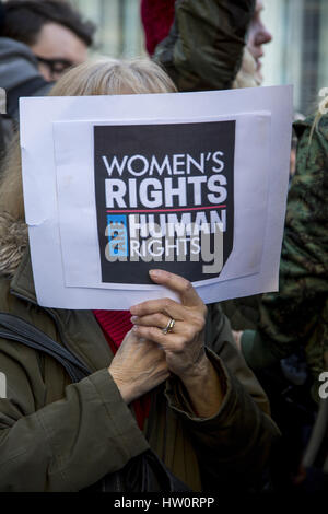 International Women's Day Rally & march to Trump International Hotel in New York City, give message as half the population, women, are holding government & especially the Trump administration responsible for its actions. Stock Photo