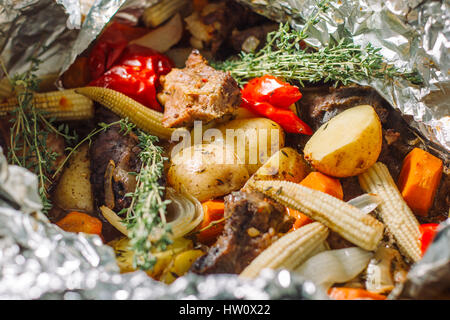 Fried potato with herbs, rosemary, small corn cobs. Stock Photo