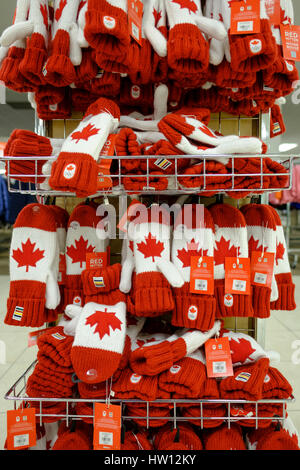 A display of maple leaf mittens, Canadian flag mittens, red & white mittens / gloves at the Hudson Bay Store in London, Ontario, Canada. Stock Photo